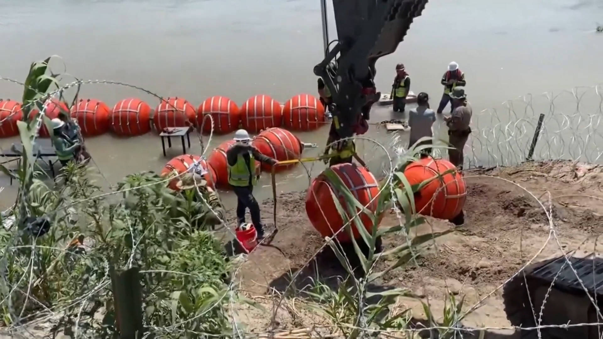 DOJ Threatens to Sue Texas Gov. Abbott for Installing Barrels Wrapped in Razor Wire in Rio Grande